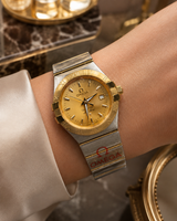OMEGA CONSTELLATION DAMA BICOLOR DORADO CON CALENDARIO